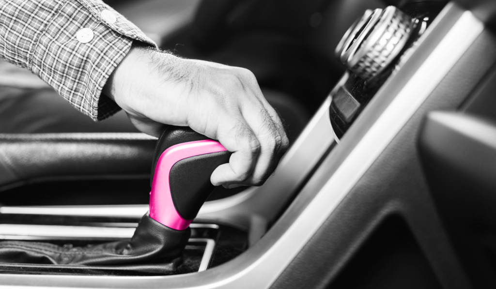 mans hand on gear stick