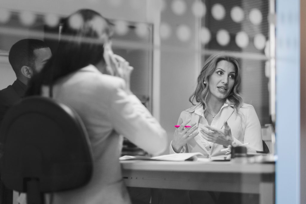 woman talking in a formal business meeting